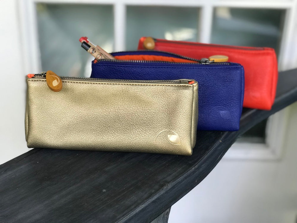 Vegan leather Union makeup pouch showing its textured surface and zipper.
