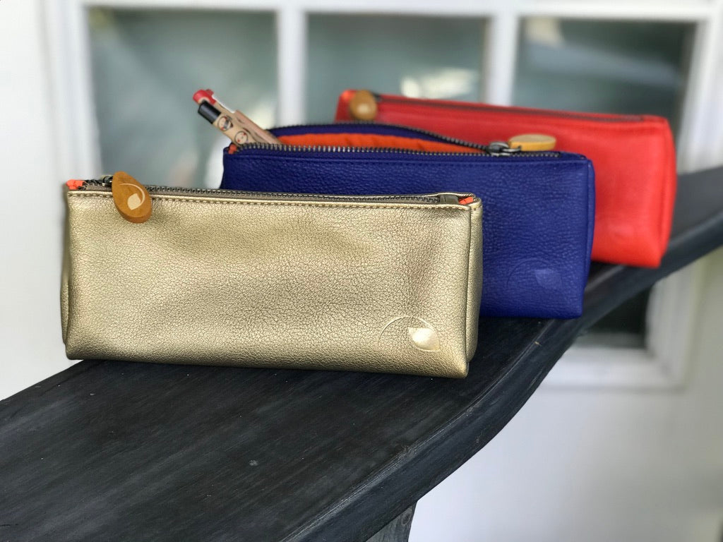 Vegan leather Union makeup pouch showing its textured surface and zipper.