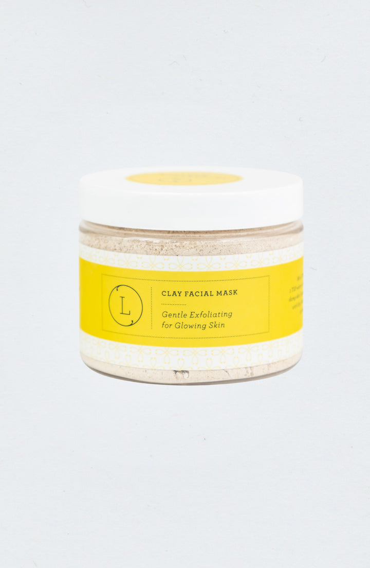 Clay facial mask in a bowl with an earthy texture.