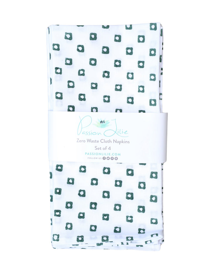 Set of four cotton napkins with a green square block print.