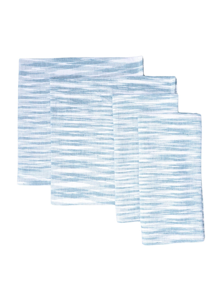 Set of four light blue handwoven cotton napkins, woven detail.