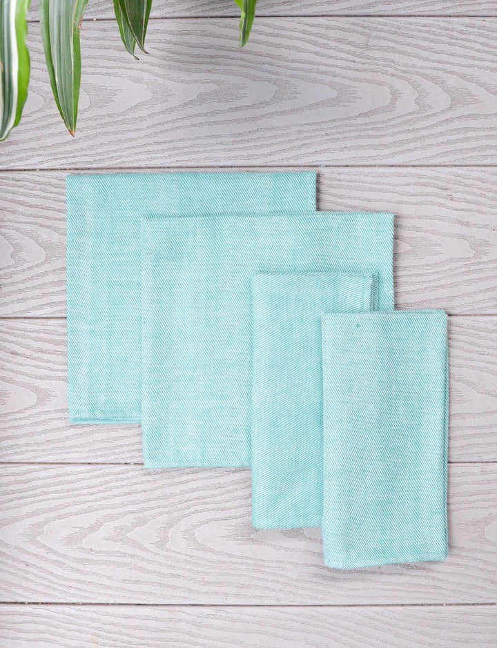 Set of four mint green handwoven cotton dinner napkins.