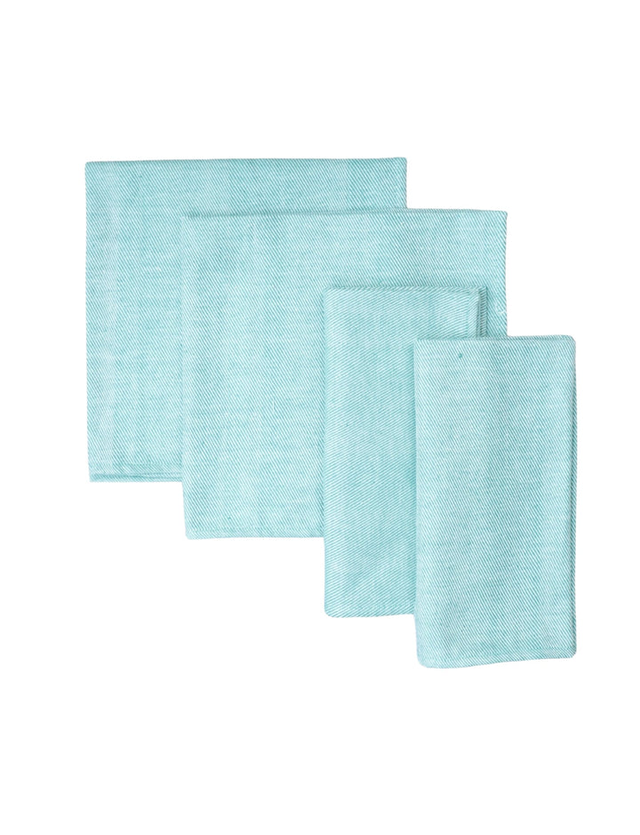 Set of four mint green cotton dinner napkins for the table.
