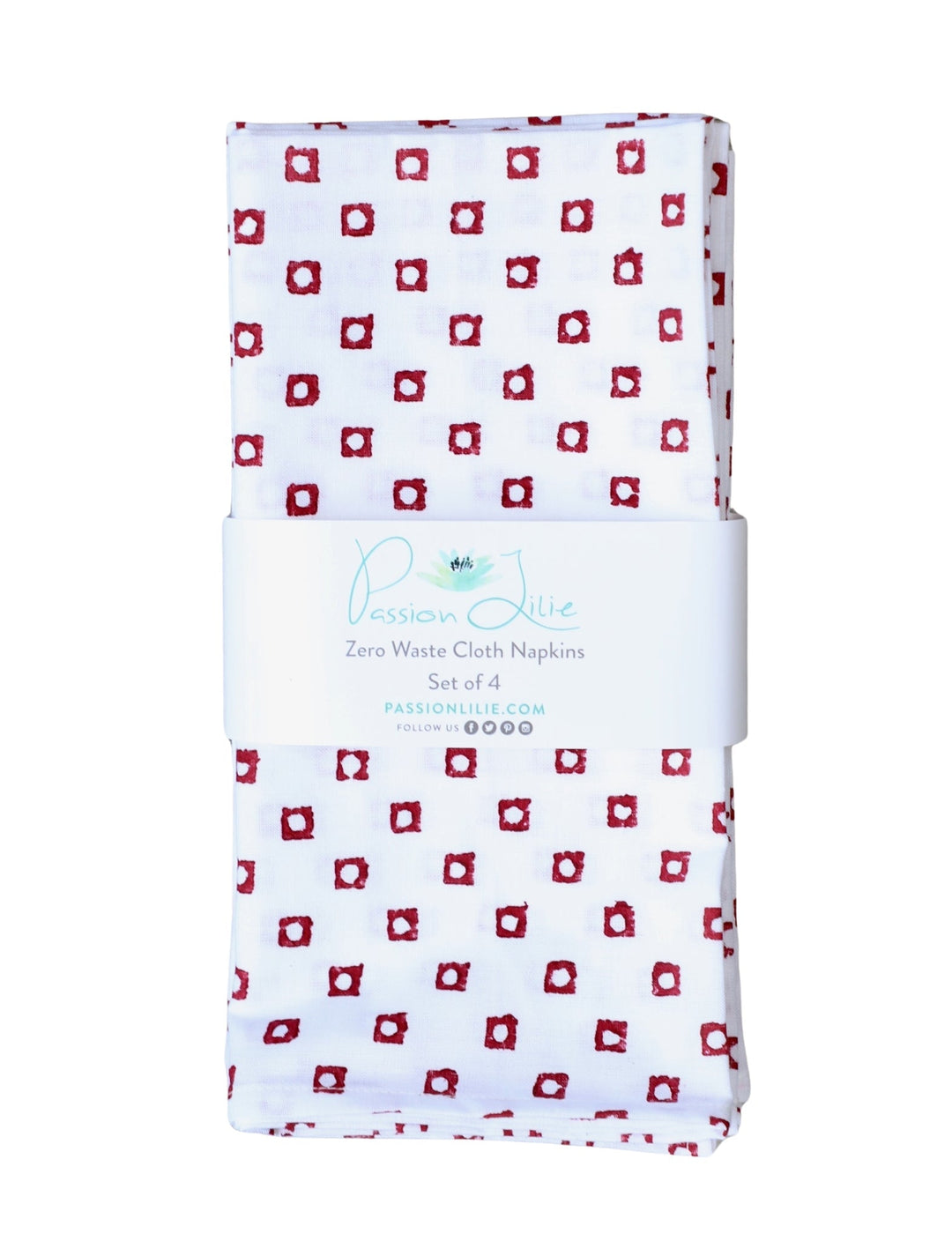 Set of four cotton napkins with a red square block print, folded.