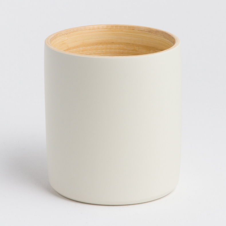 Ly bamboo mug in a natural finish with a smooth surface.