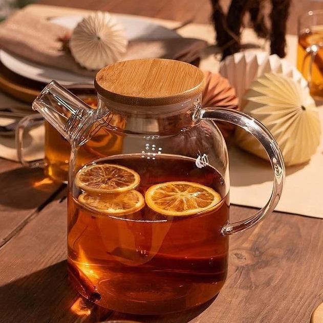 Large 54 oz glass teapot with a handle and lid, for hot and cold beverages.