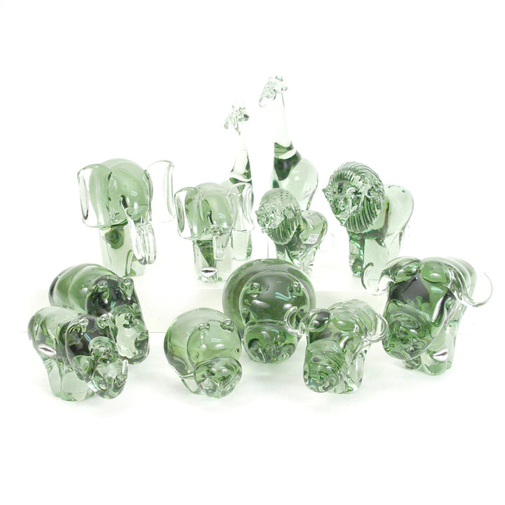 Handblown recycled-glass buffalo figurine catching the light.