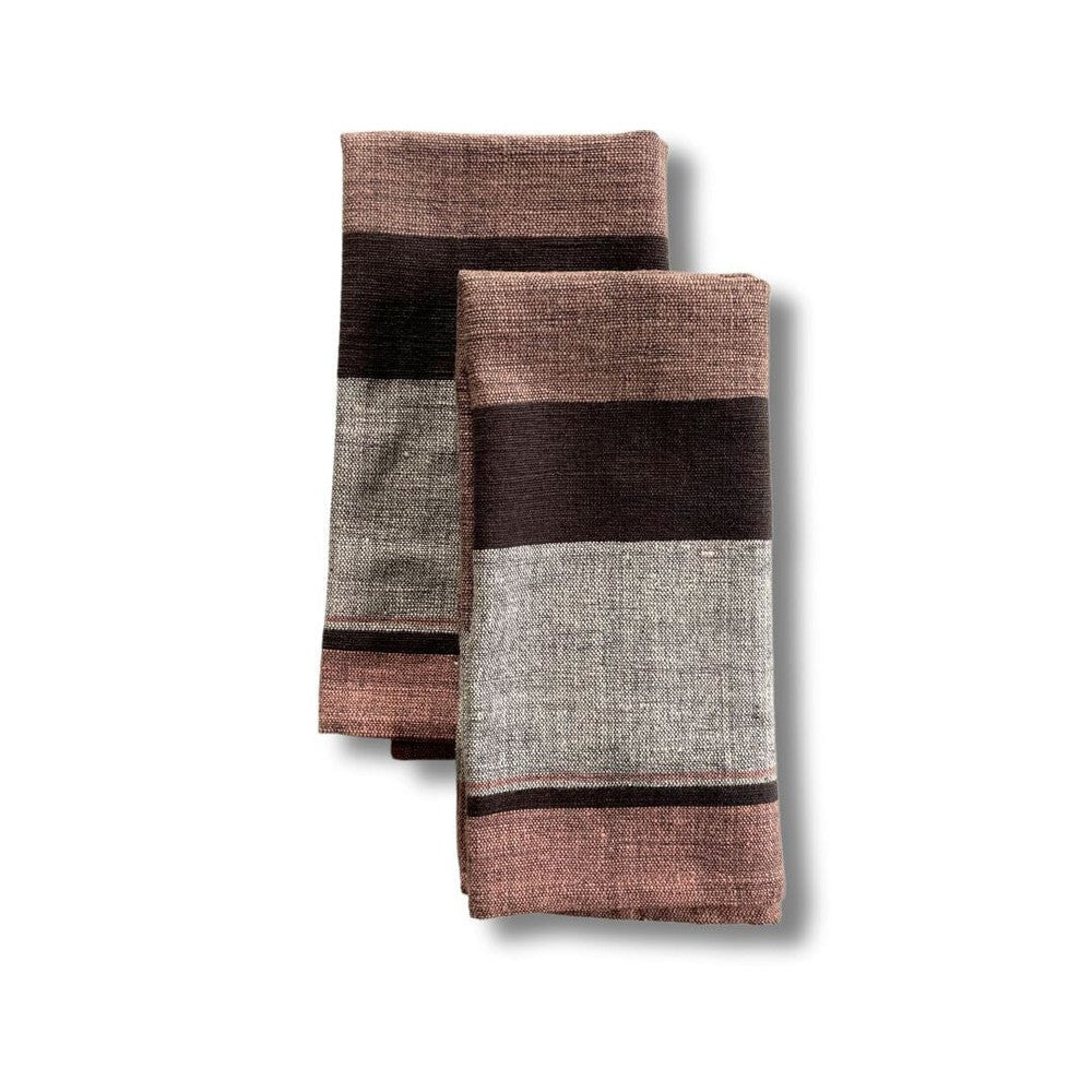 Pair of blush color block cotton dinner napkins, folded
