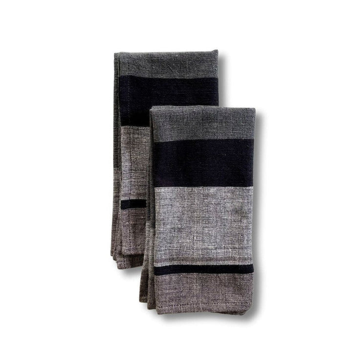 Pair of grey color block cotton dinner napkins, folded