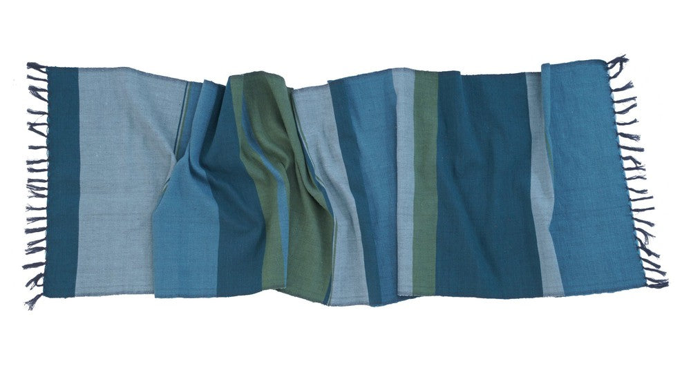 Steel blue handwoven Ethiopian cotton table runner in bands of blue and green, laid flat with tied fringe
