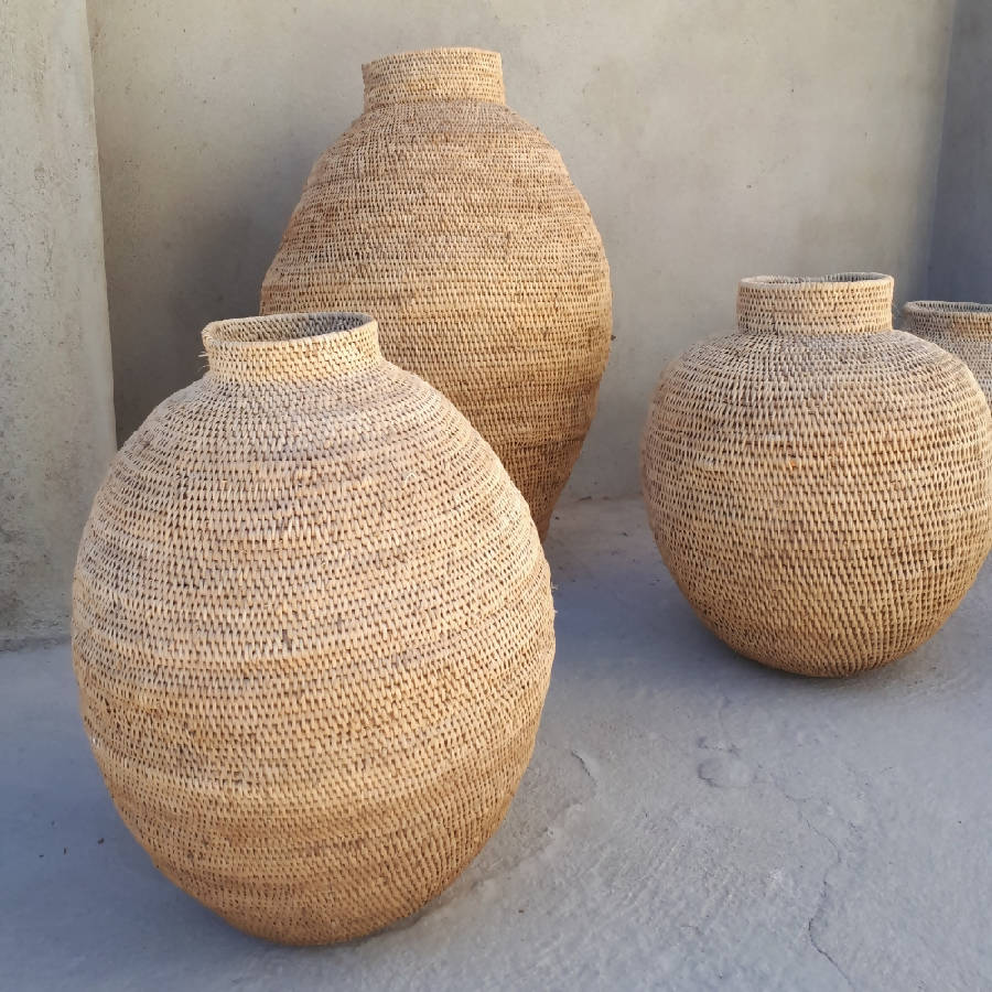 Handwoven Zimbabwean cane storage baskets with handles, traditional Buhera basketry.