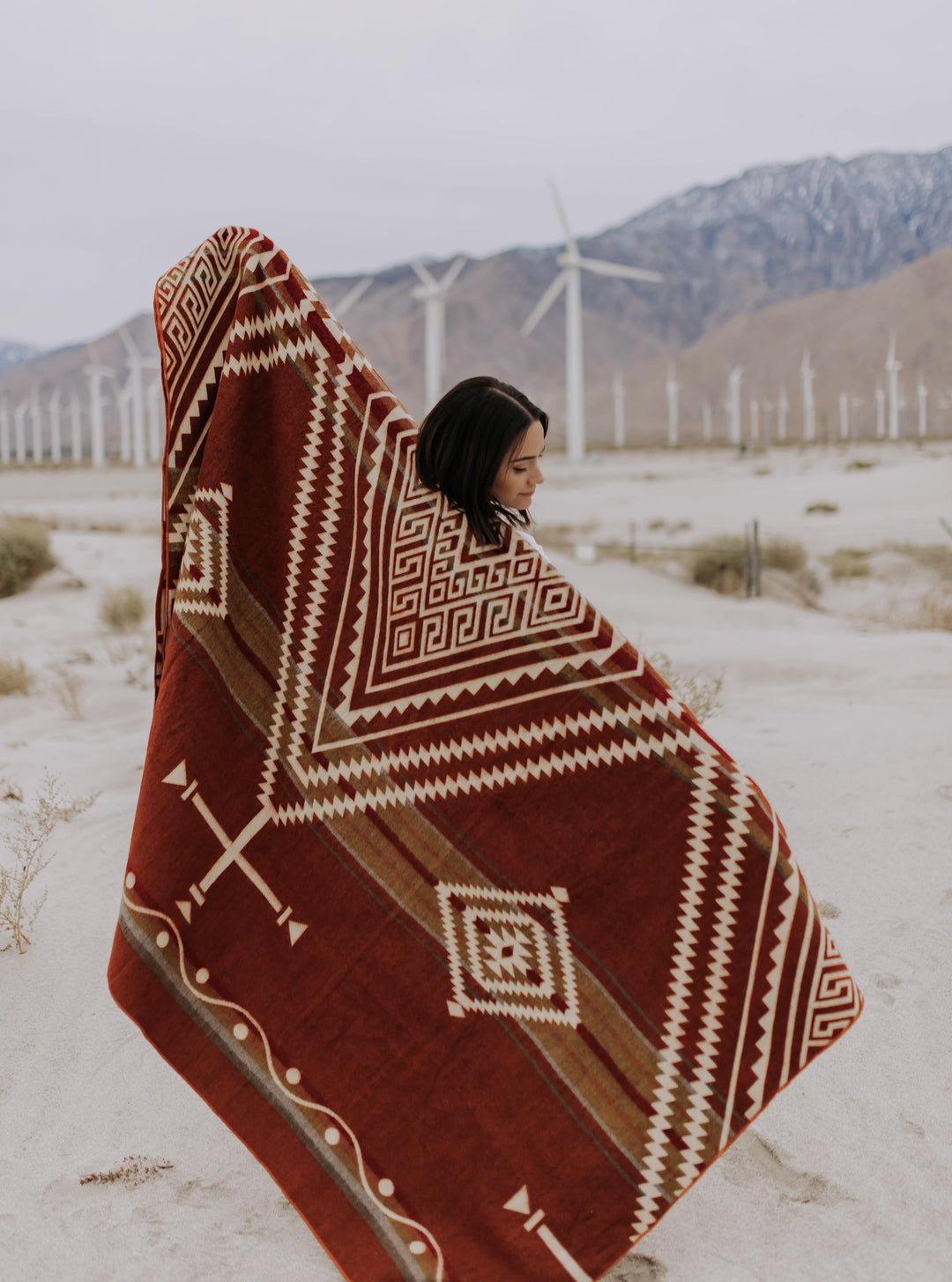 Rust-toned Achuar Autumn blanket with cream Andean geometric, made in Ecuador.