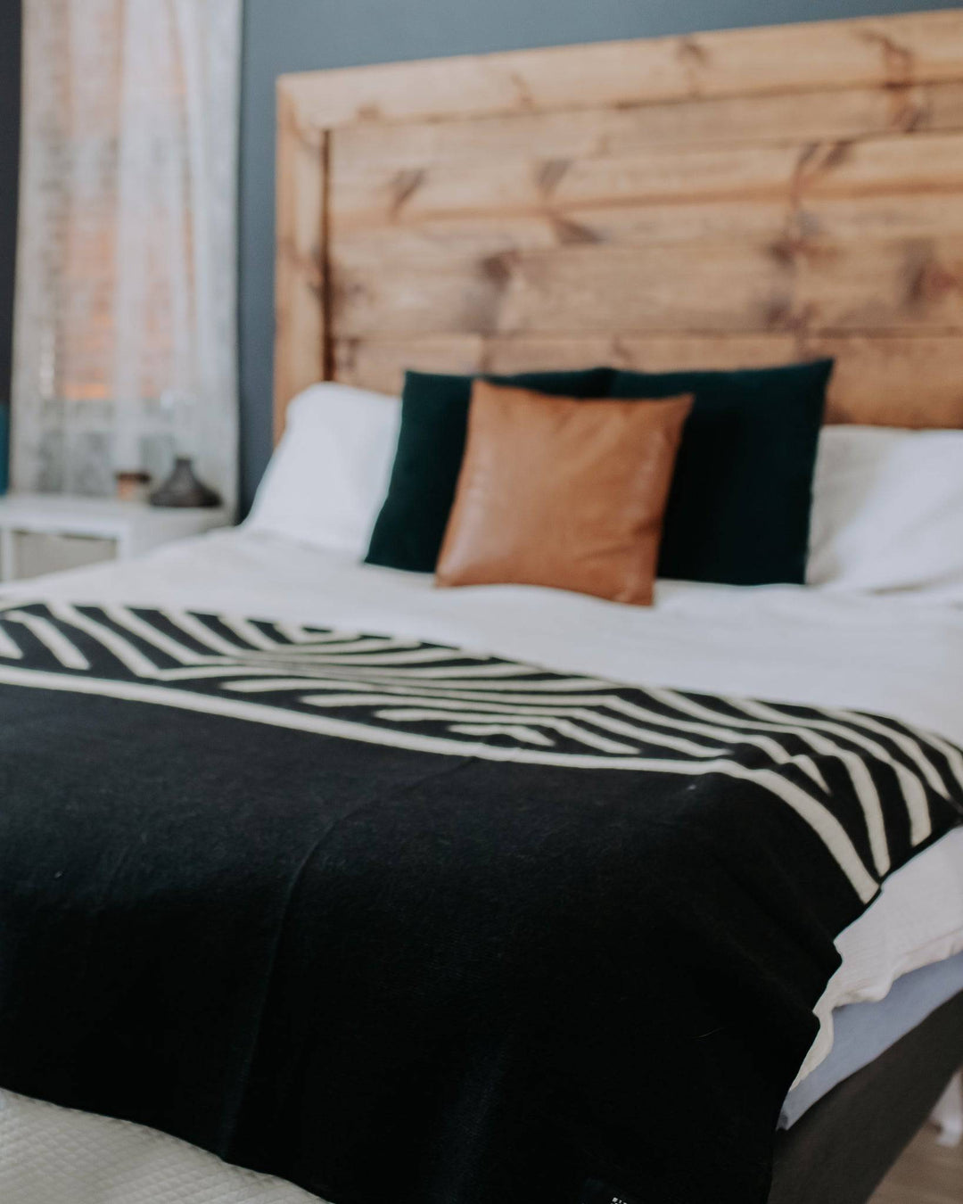 Paramo Andean throw in black and cream, 92 by 78 inches, made in Ecuador.