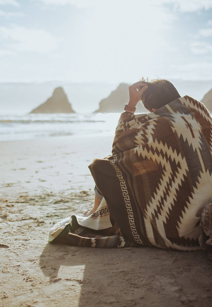 Handwoven Shuar blanket in browns and tan with grey accents, reversible design.