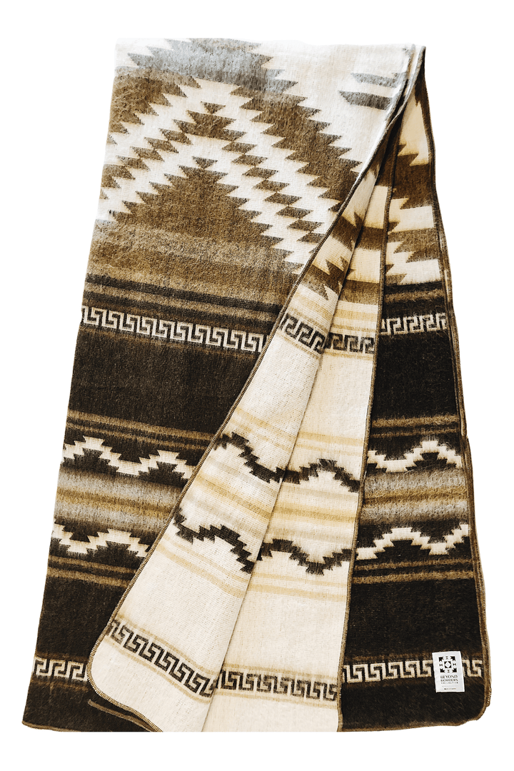 Shuar Dusty Brown Andean blanket in chocolate, tan, and cream with stepped diamonds and Greek-key borders.