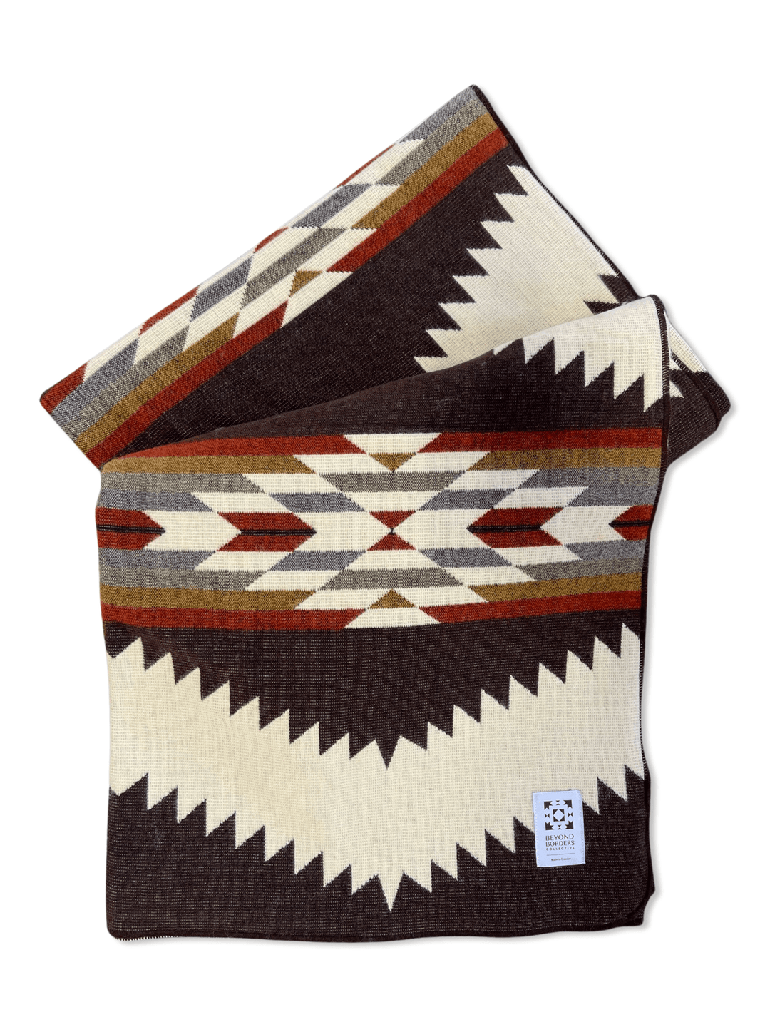 Tsachila Chocolate Andean blanket in cream with bold chocolate-brown zigzag bands and mustard, rust, and burgundy diamond accents.