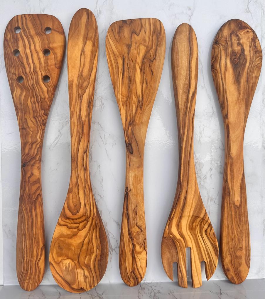 Set of five olive wood kitchen utensils including spoons and spatulas, ideal for cooking and serving.