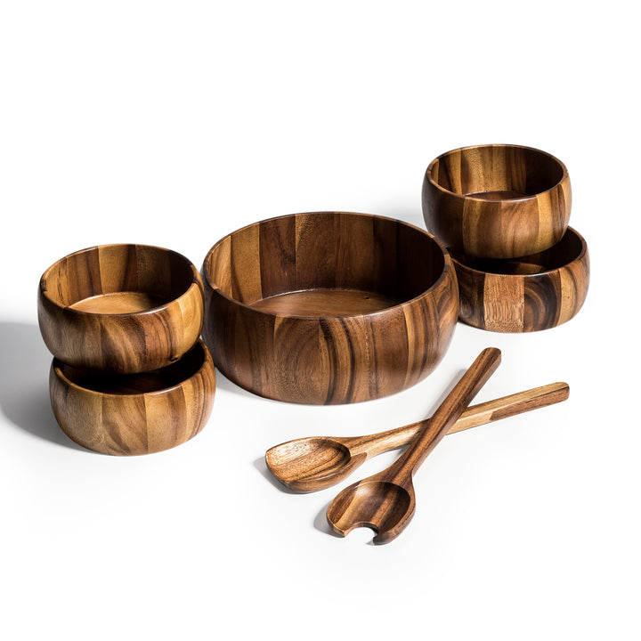 Dragor seven-piece acacia wood salad bowl set with servers.