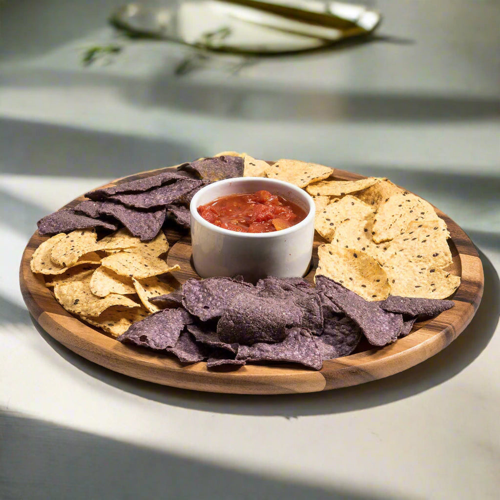 Acacia wood chip and dip serving set with a ceramic bowl for snacks and dips.