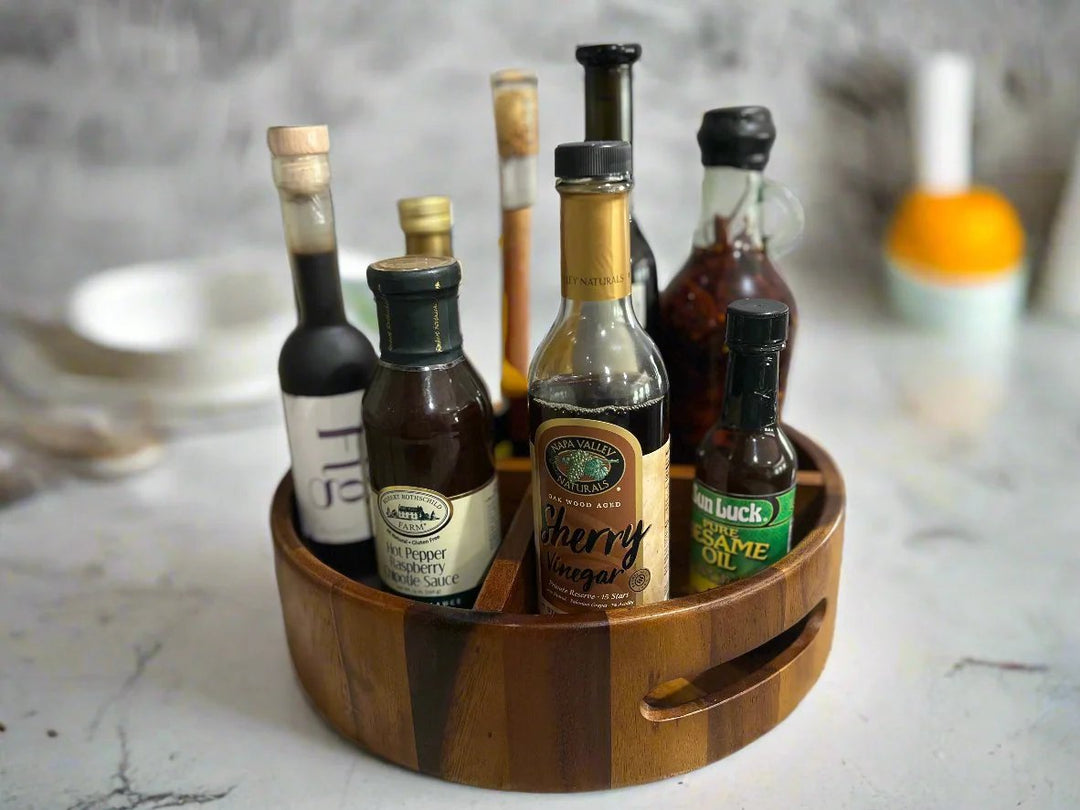Acacia wood rotating lazy Susan divided tray for dining or kitchen use.