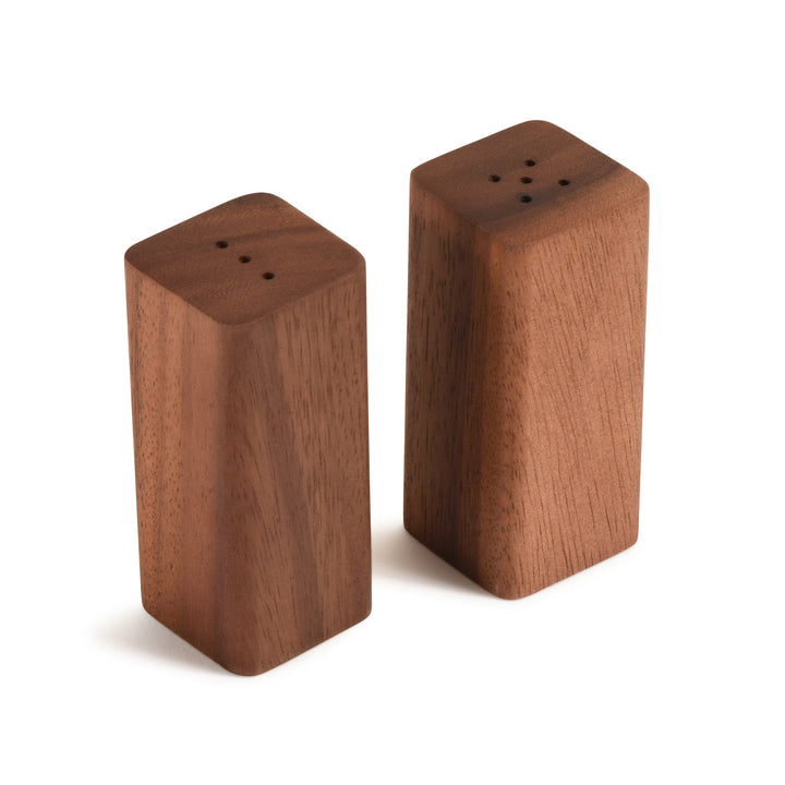 Acacia wood salt and pepper shakers on a matching wooden base.