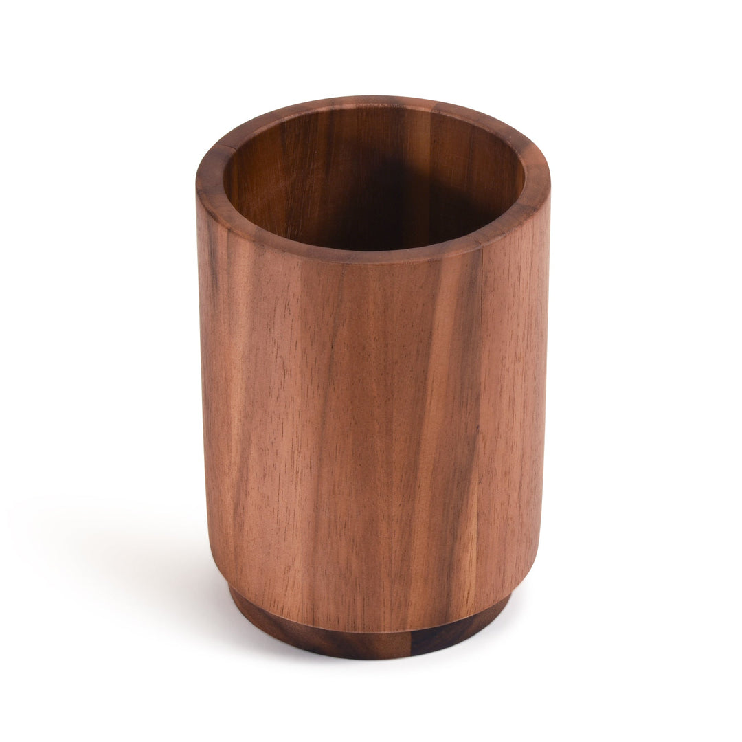Acacia wood rotating lazy Susan utensil holder with compartments for kitchen tools.
