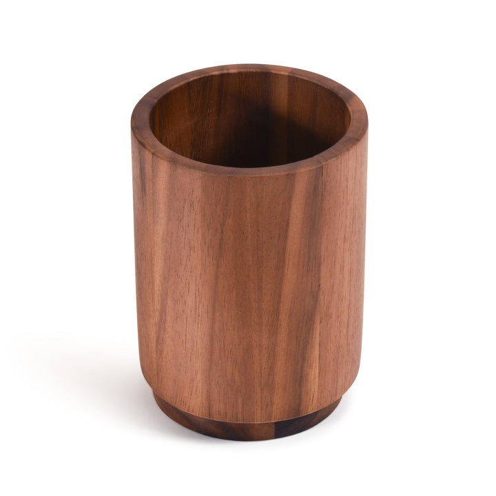 Acacia wood rotating lazy Susan utensil holder with compartments for kitchen tools.