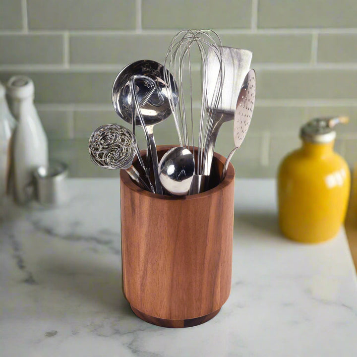 Acacia wood rotating lazy Susan utensil holder with multiple compartments.