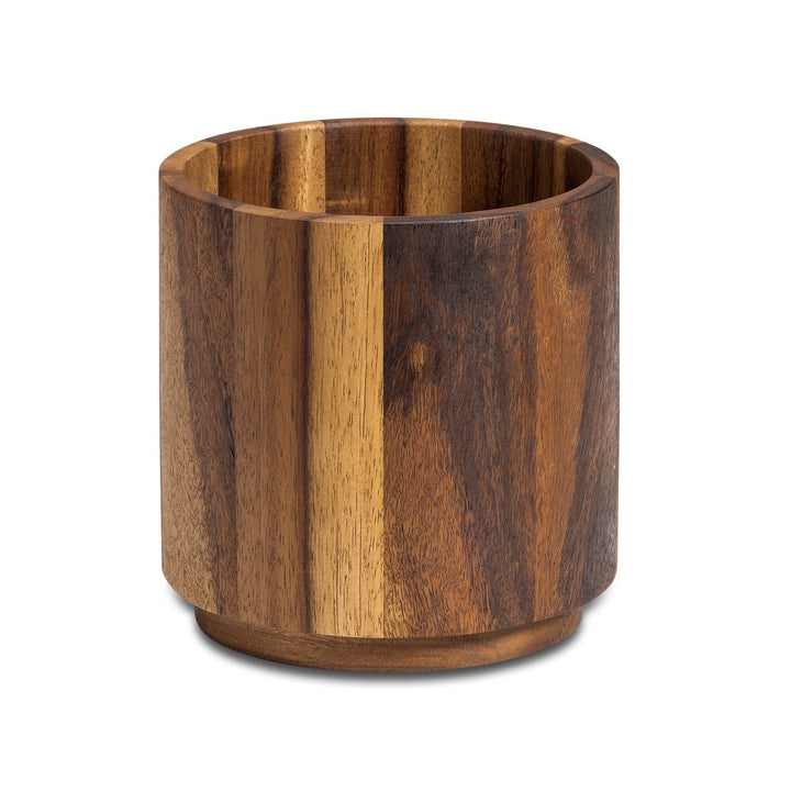 Acacia wood rotating lazy Susan utensil holder for utensils and cutlery.