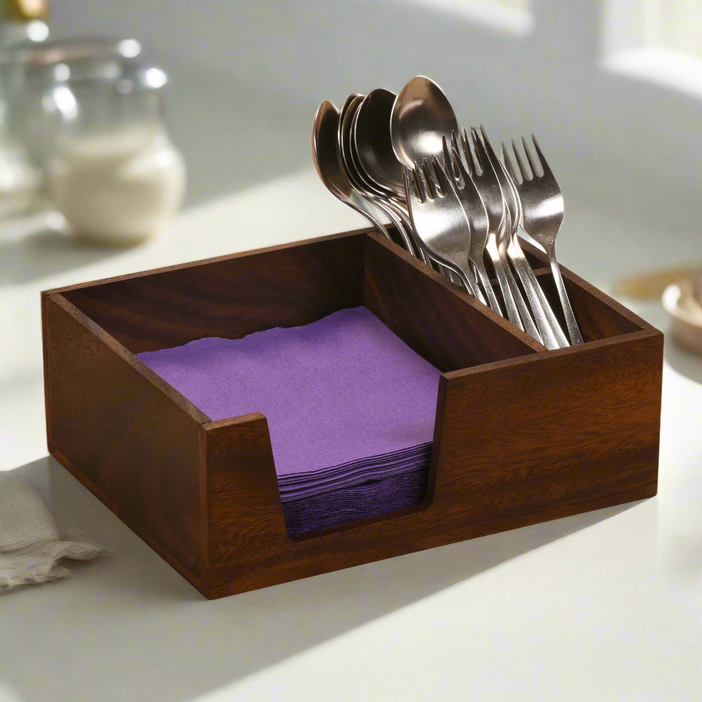 Acacia wood flatware and napkin caddy with two compartments for dining storage.