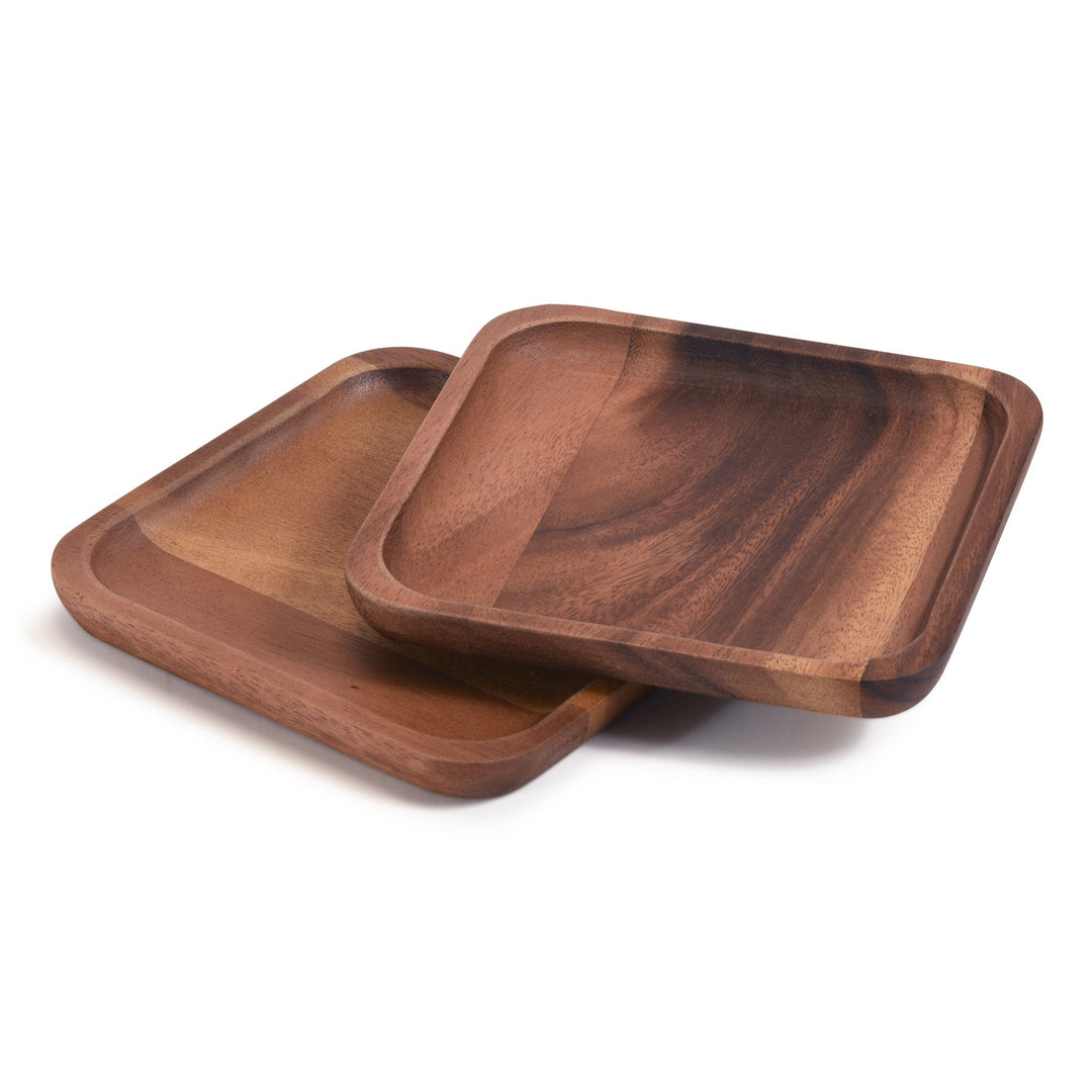 Set of two acacia wood square plates with natural grain and a smooth finish.