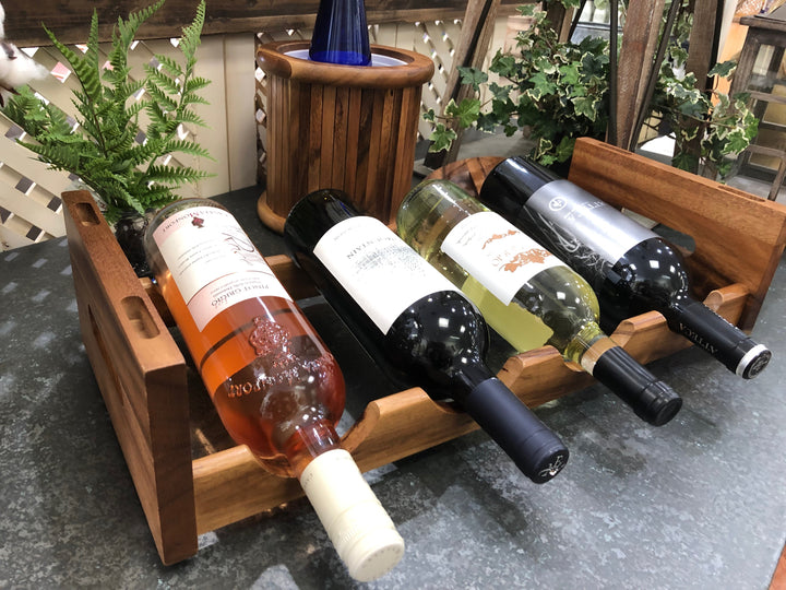 Acacia wood stackable wine rack holding four bottles, natural finish.