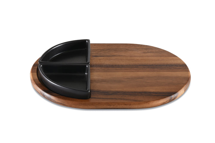 Acacia charcuterie board with two triangular ceramic bowls for serving cheese and appetizers.