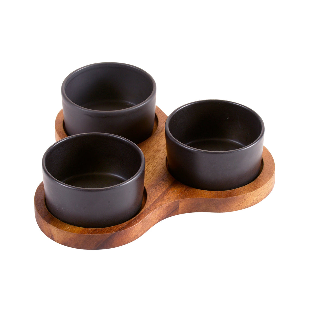 Triangular acacia server with three round ceramic bowls for serving appetizers or dips.