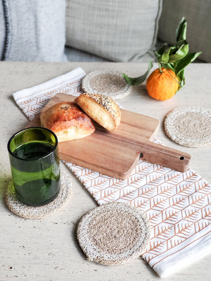 Handwoven drink coasters with jute center and lacy cream border, set of 4