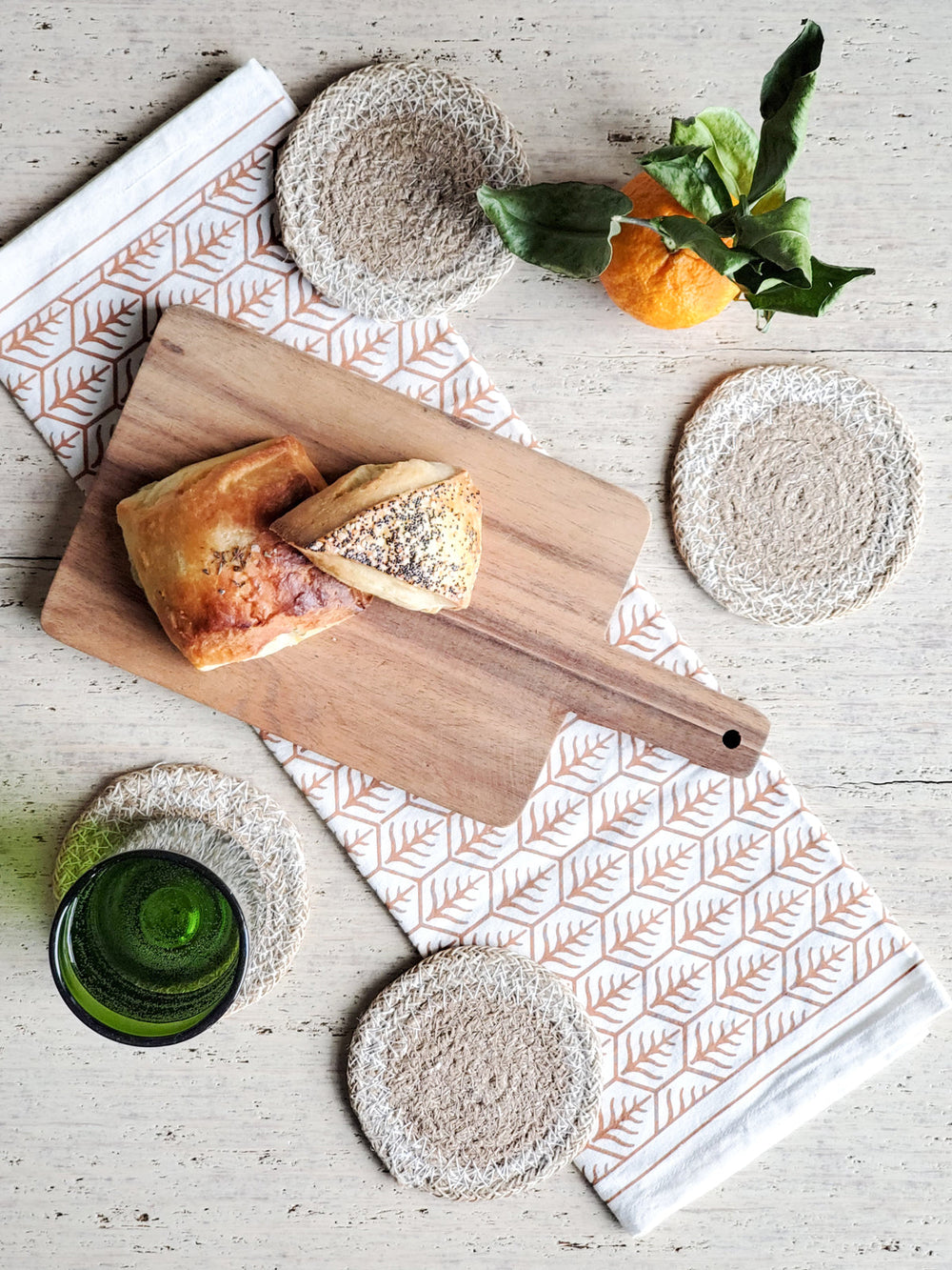 Two-tone jute coasters featuring tan braided center and substantial cream openwork edge