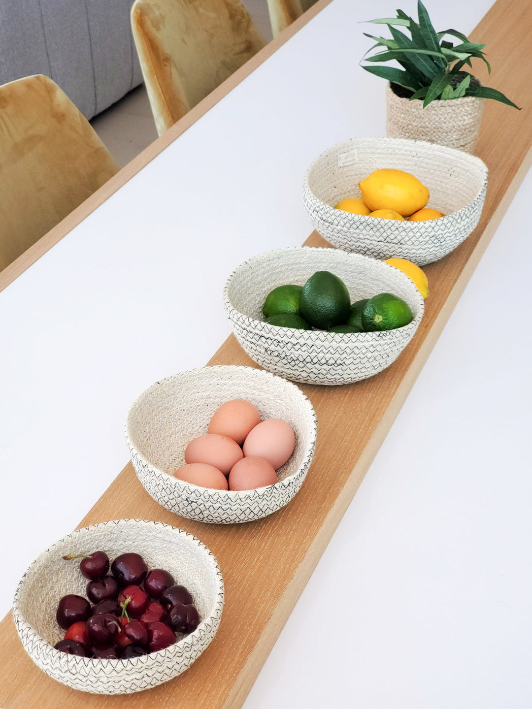 Graduated jute storage bowls, handwoven with contrasting black stitch detail