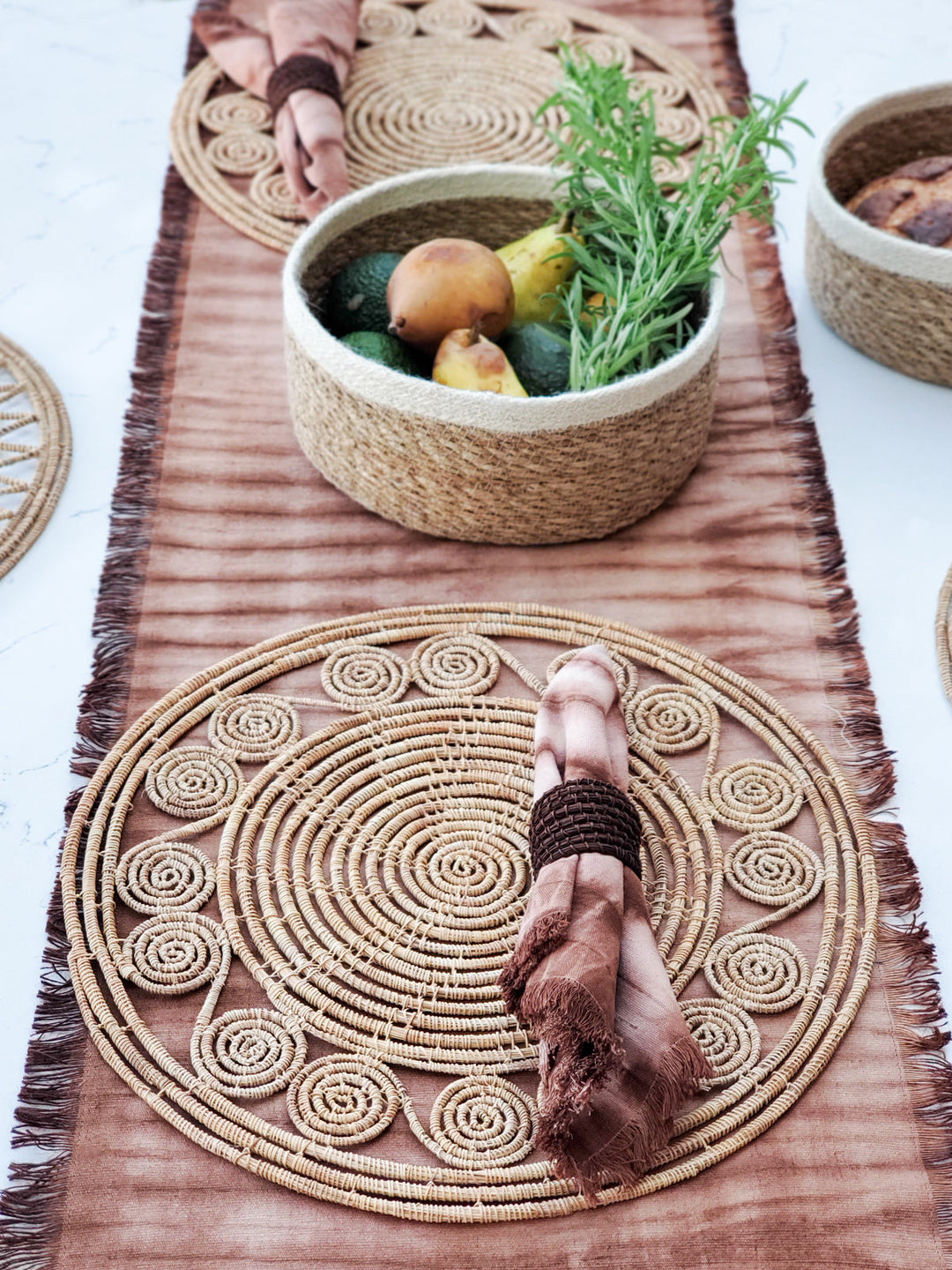 Natural palm fiber placemats featuring small spiral medallions around concentric weave, set of 2