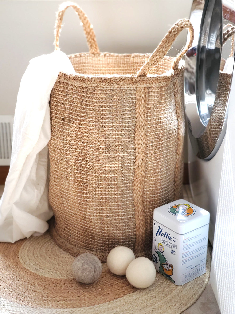 Natural braided jute hamper by DC-KORISSA showing a woven storage basket with sturdy handles and a natural jute finish.