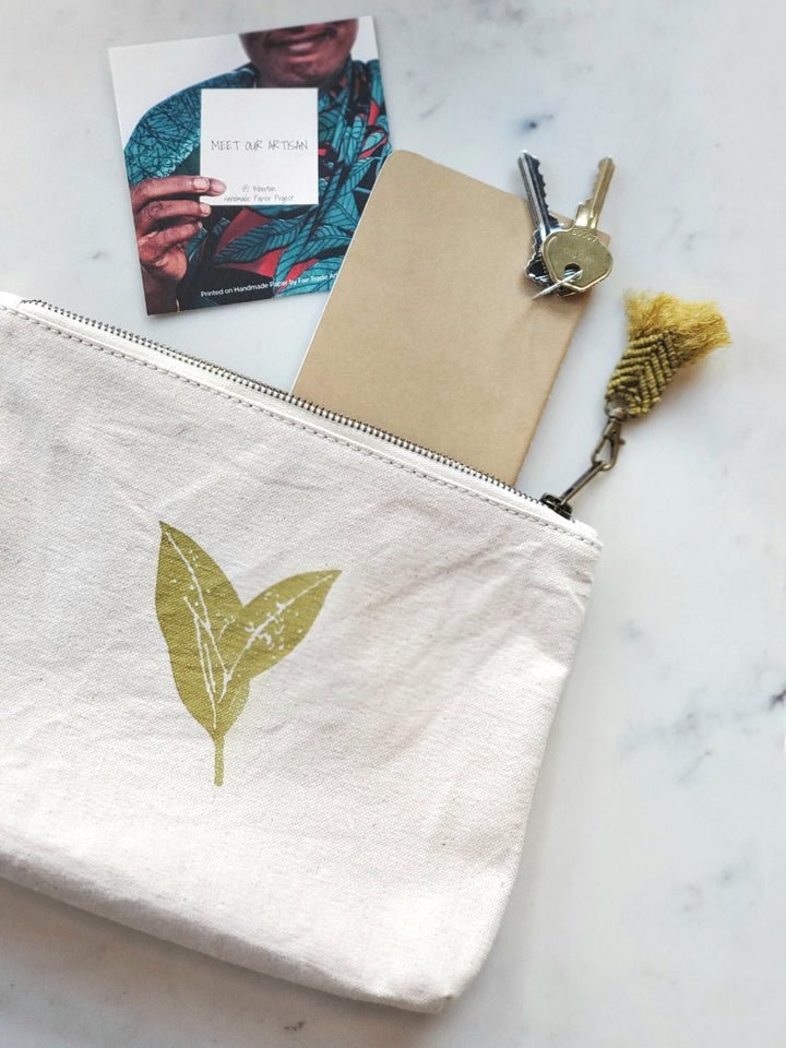 Cotton canvas zip pouch with hand-printed botanical motif, sage on cream
