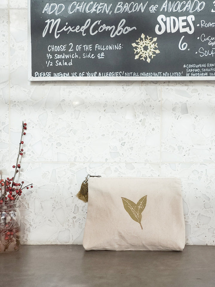 Cream canvas pouch with sage nature print and woven hemp tassel pull