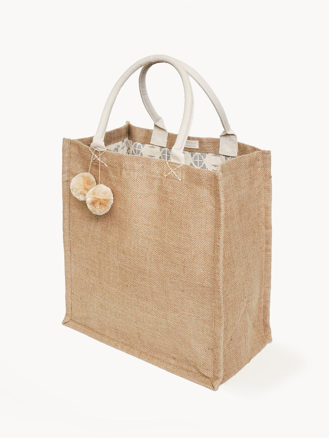 Spacious jute canvas market bag with colorful pompoms and sturdy handles