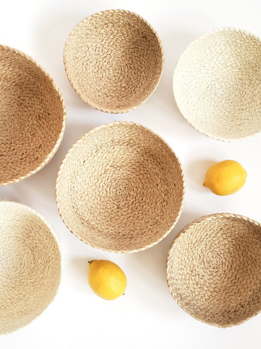 Set of four white jute Kata Storage Bowls by DC-KORISSA, showcasing their natural woven texture and versatile design.