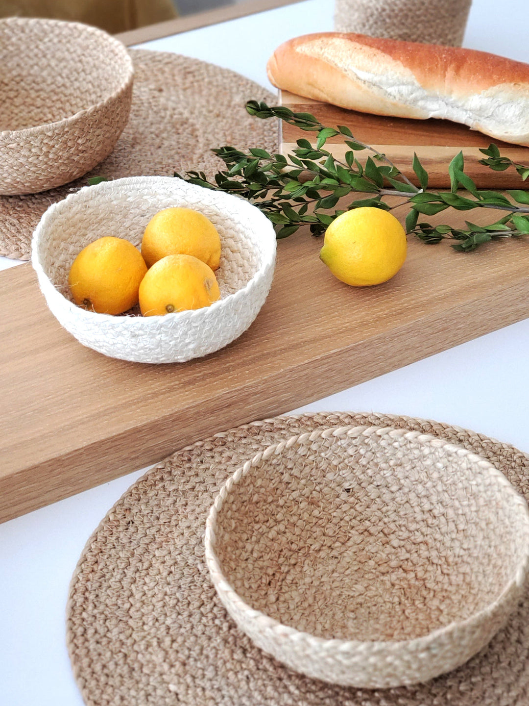 Set of four white jute storage bowls from DC-KORISSA&