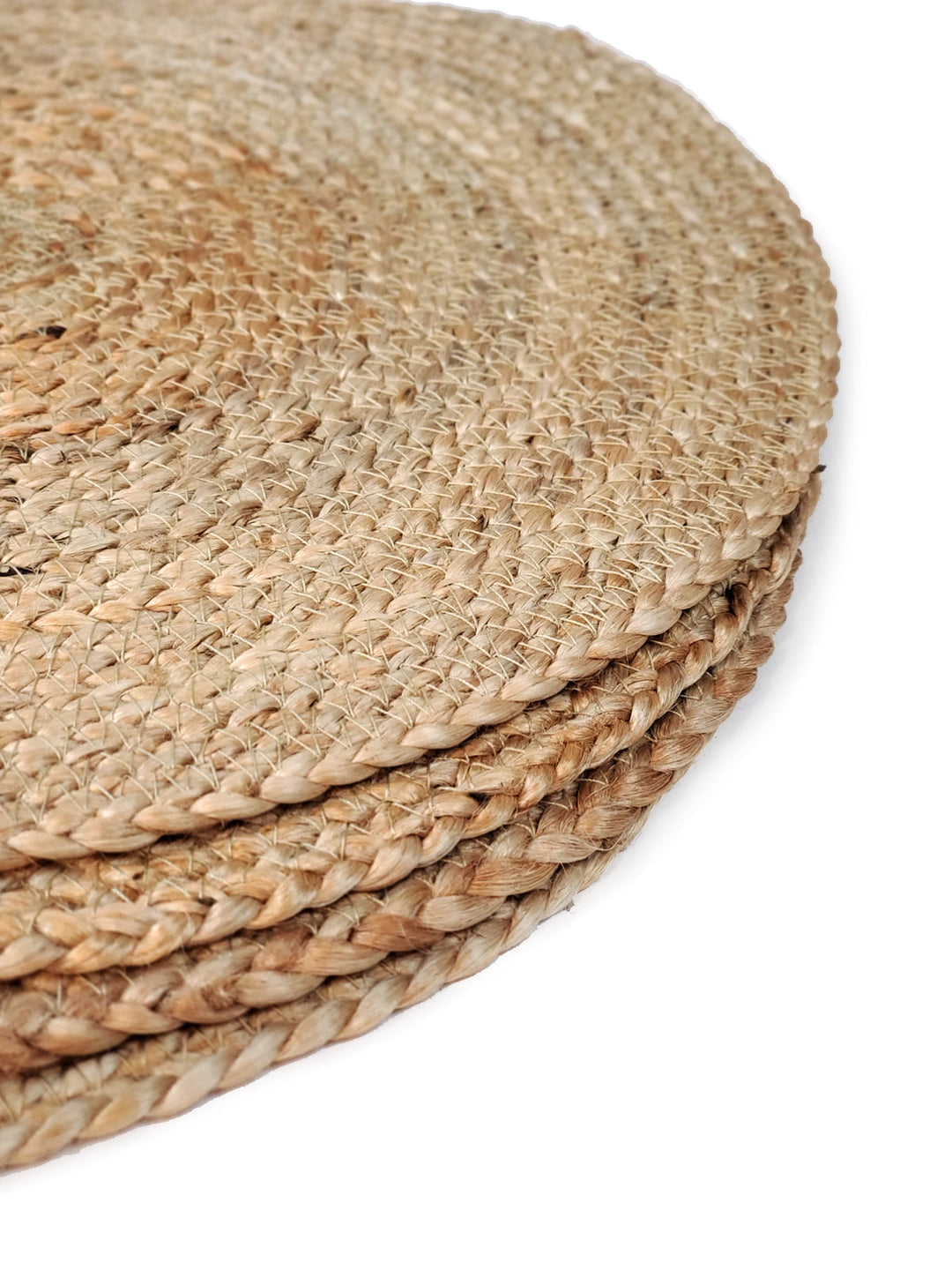 Set of four natural jute Kata round placemats by DC-KORISSA, showcasing textured woven surface for dining table decor
