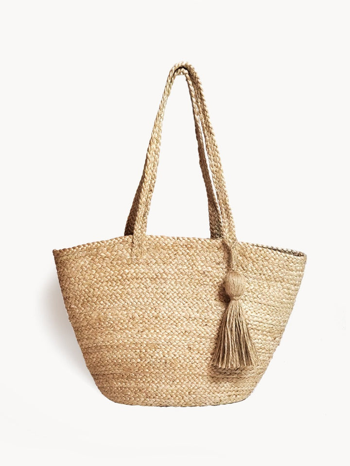 Handwoven natural jute shoulder bag with spacious interior and carry strap