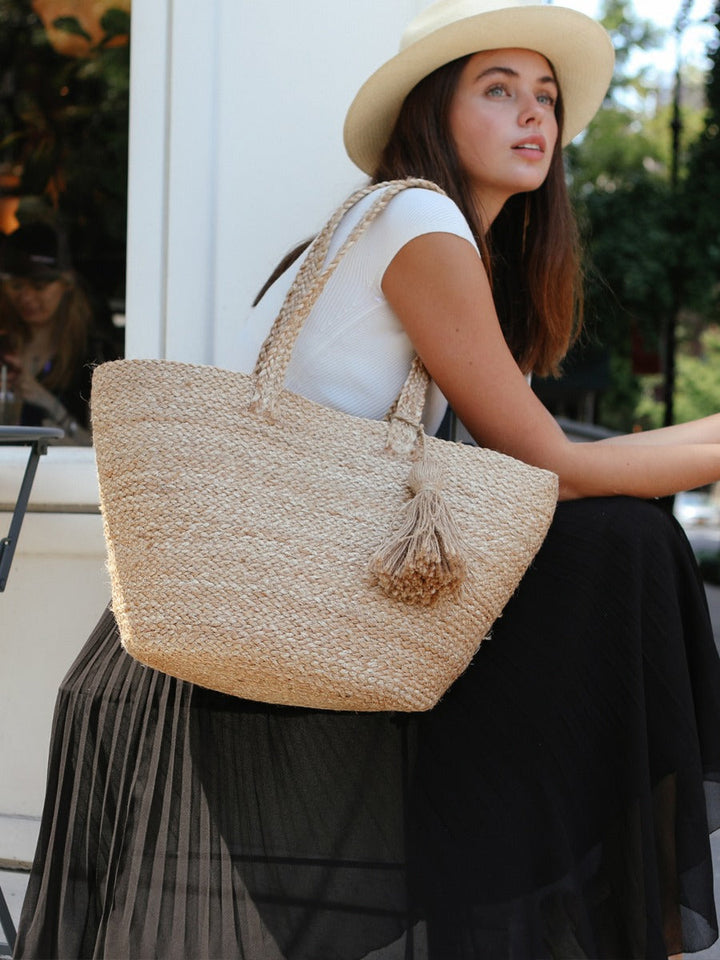 Jute shoulder bag in natural fiber, front view showing woven texture