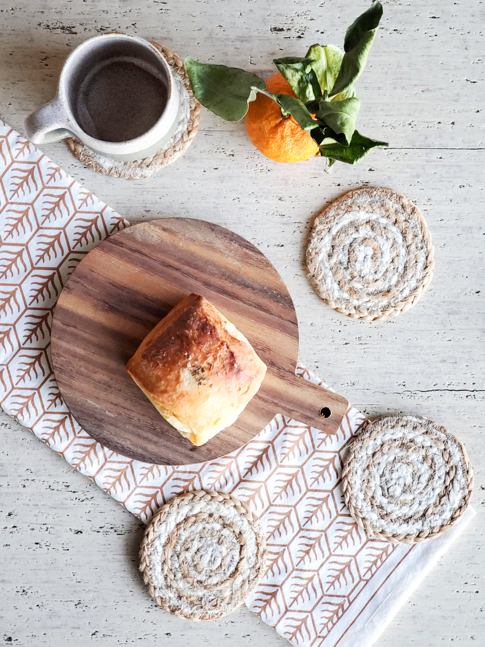 Spiral-pattern jute coasters with distinctive white spiral design on tan jute base