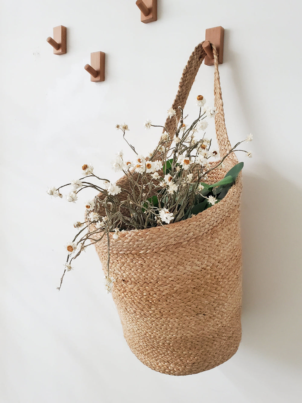 Hand-braided jute wall-mounted basket for plants, mail, or entryway storage
