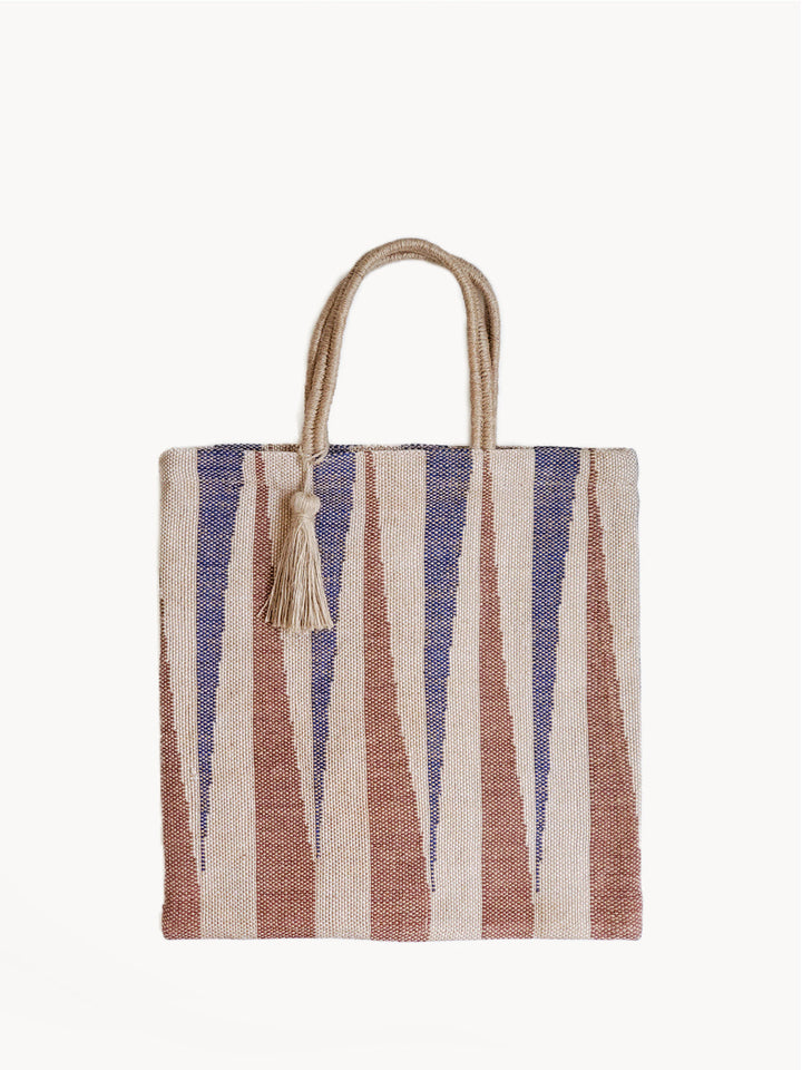 Striped jute tote bag with rust, navy, and natural vertical stripes